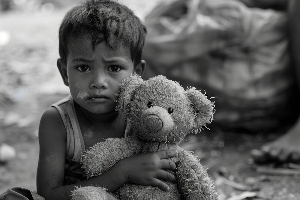 Poverty kid with teddybear photography accessories accessory.