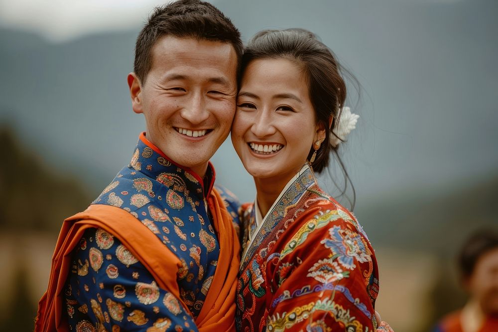 Bhutanese couple hugging wedding bridegroom clothing.
