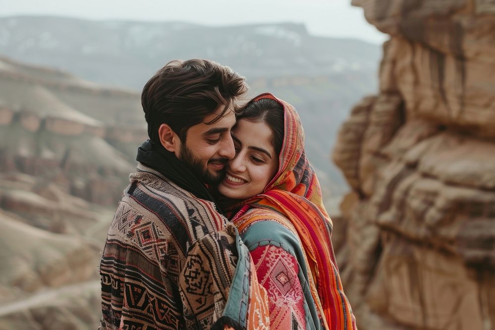 Pakistani couple hugging together face blanket person.