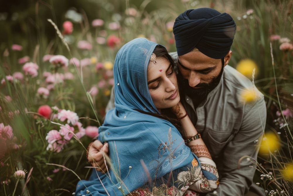Pakistani couple hugging together bridegroom clothing apparel.