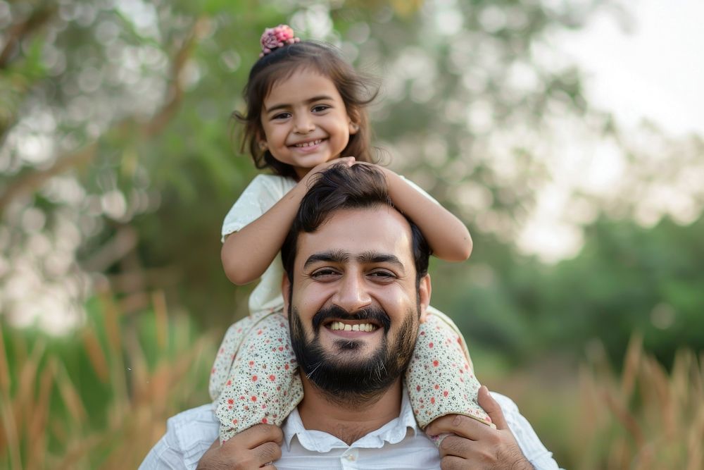 Pakistani dad carrying little daughter photo photography portrait.