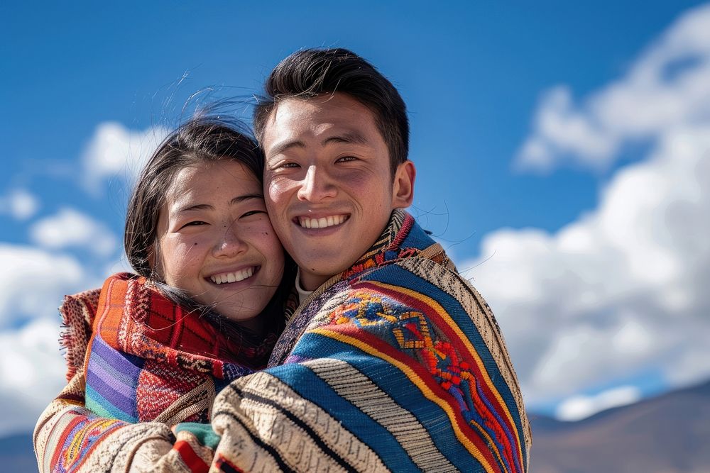 Bhutanese couple hugging together blanket person people.