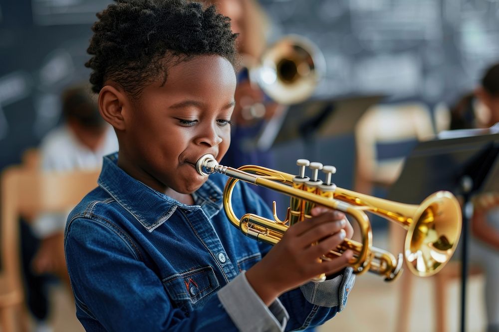 Teacher teaching black boy play trumpet at music classroom recreation performer musician.