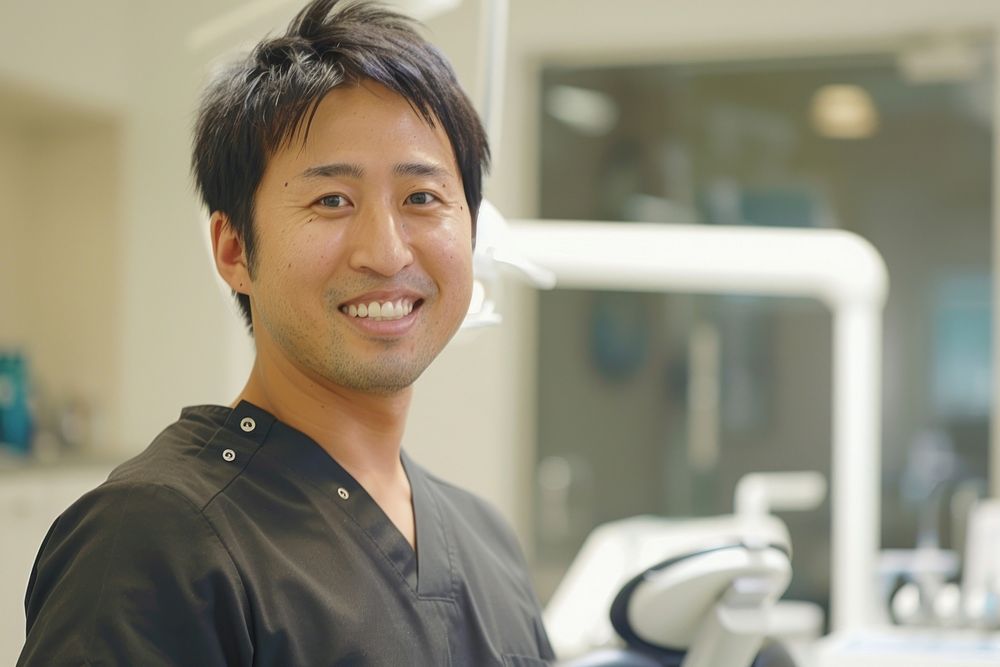 A asian man dentist smile aganist dental person adult human.