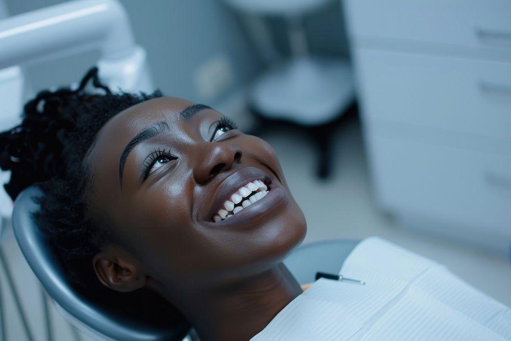 Black woman mouth open sitting on dentist chair laughing person female.
