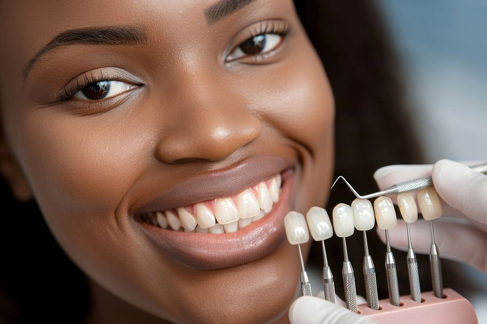 Dentist hold teeth palette near woman smiling toothbrush person device.