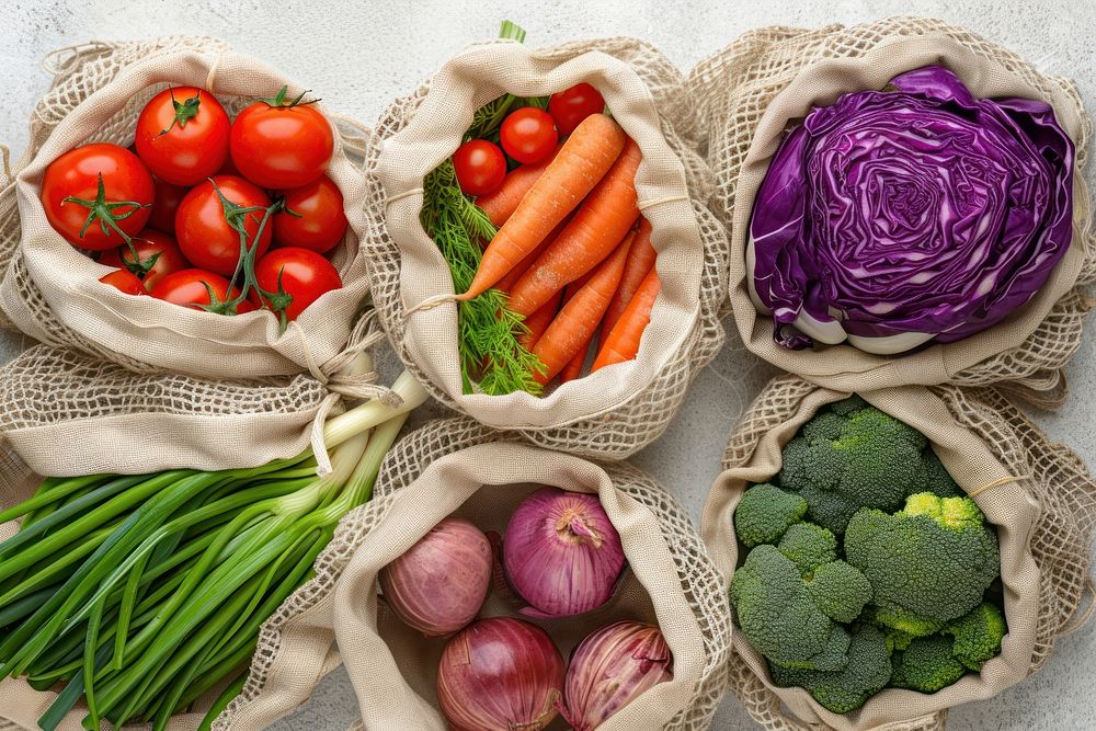 Vegetables in net bags produce food.
