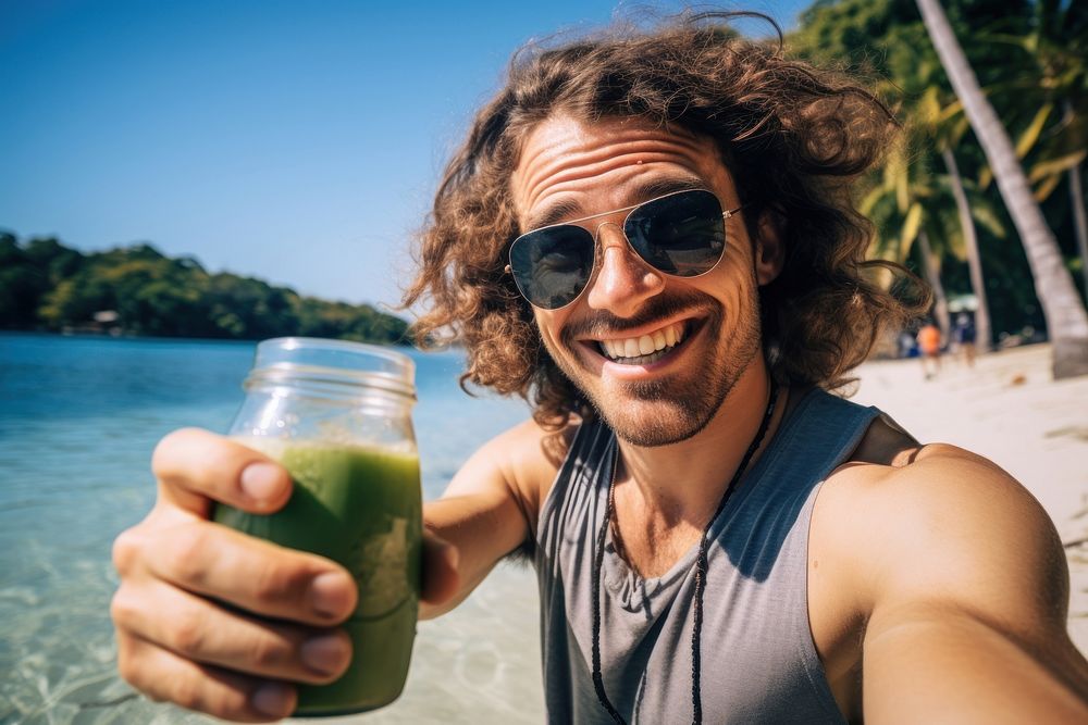 Adult man happieness with drinking coconut water photography selfie accessories.