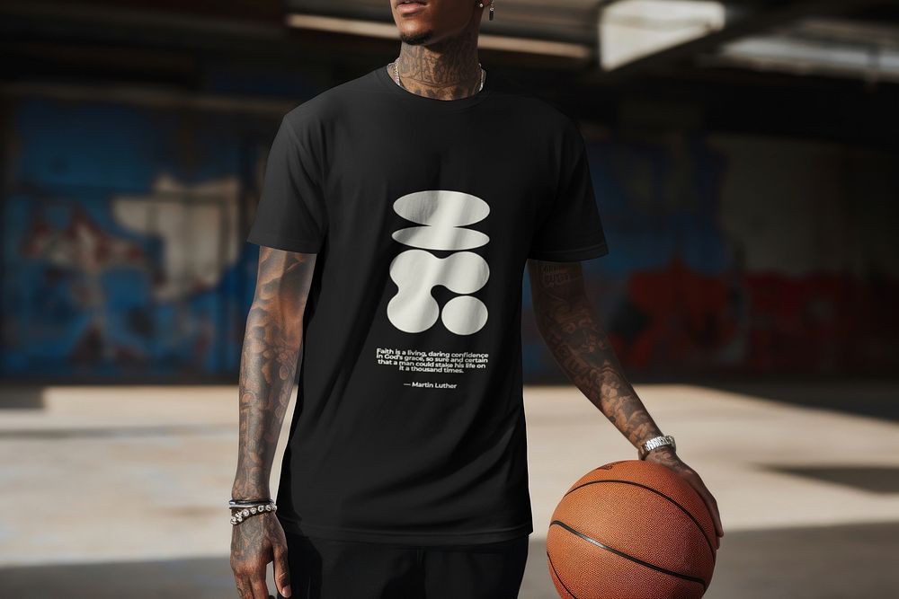 Man in black t-shirt playing basketball