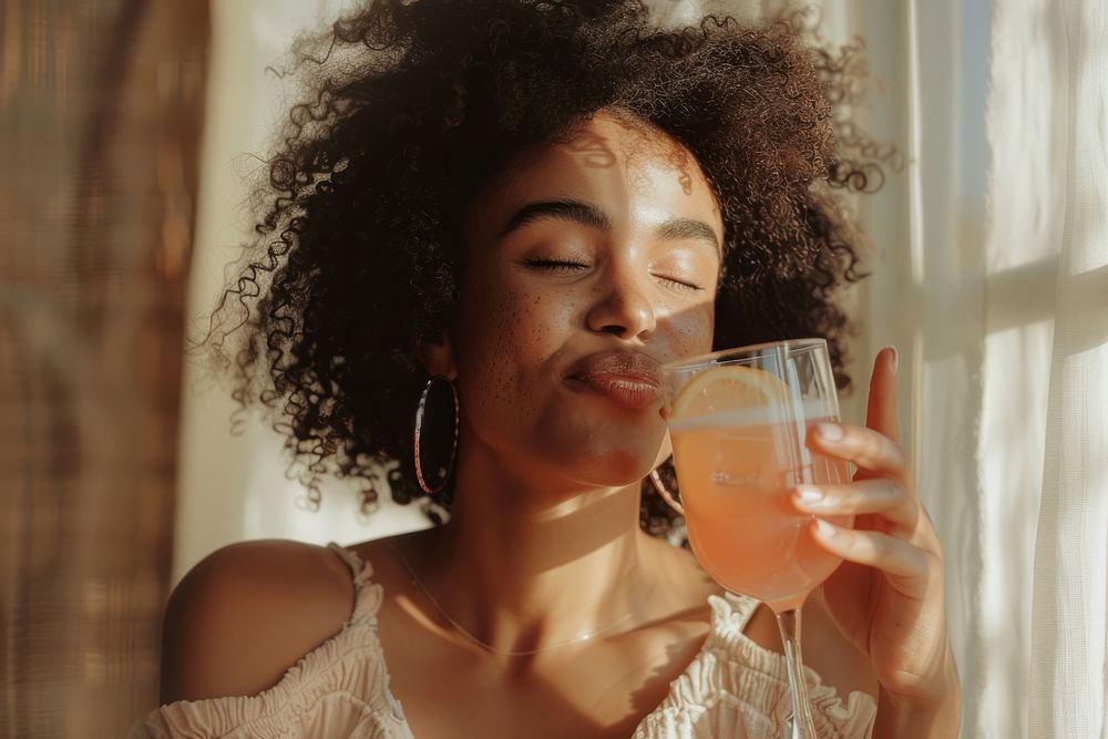 Black woman drinking a cocktail accessories accessory beverage.