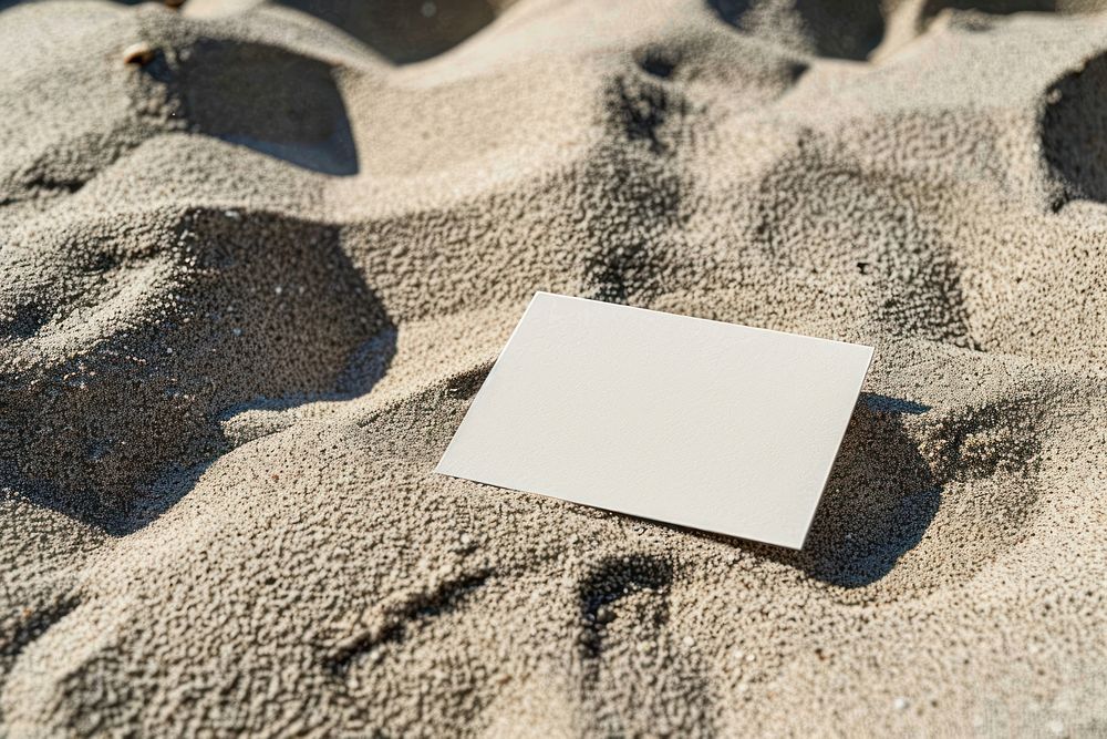 A business card mockup paper sand publication.
