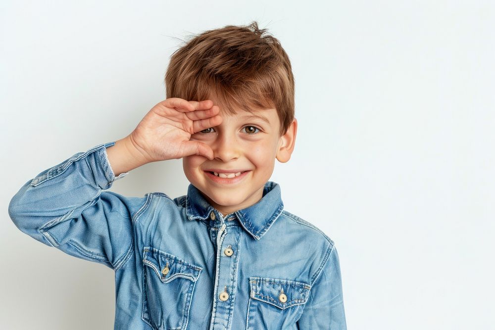 Kid covering one eye with hand smile photo face.