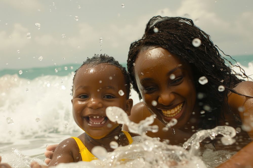 Mother and child playing in the water photography recreation shoreline.