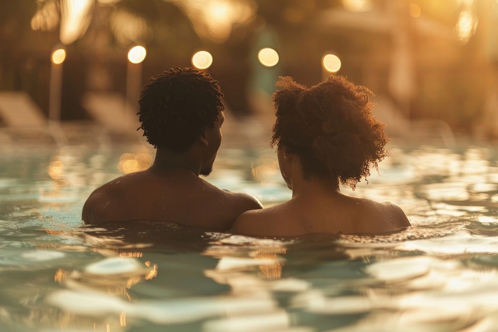 Black couple swimming in a pool recreation astronomy outdoors.