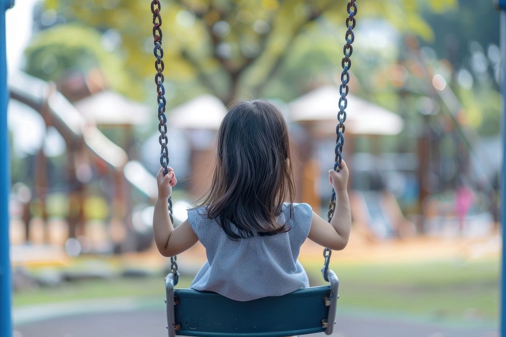 Kid girl playing swing outdoors female person.