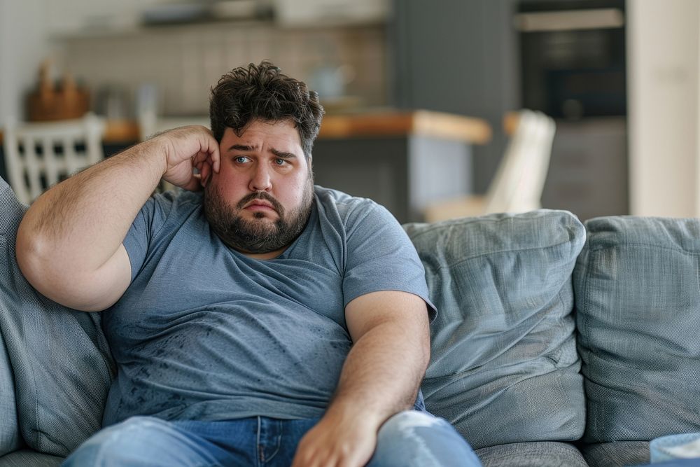 Stressed plus size man furniture worried person.