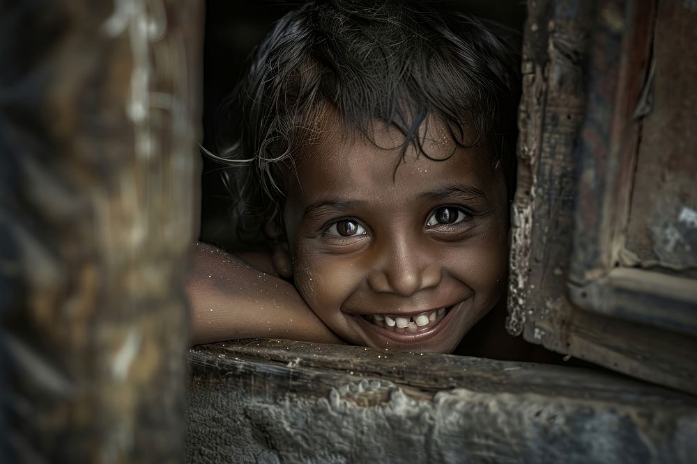 Poor child smiling happily in an atmosphere of poverty person female hiding.