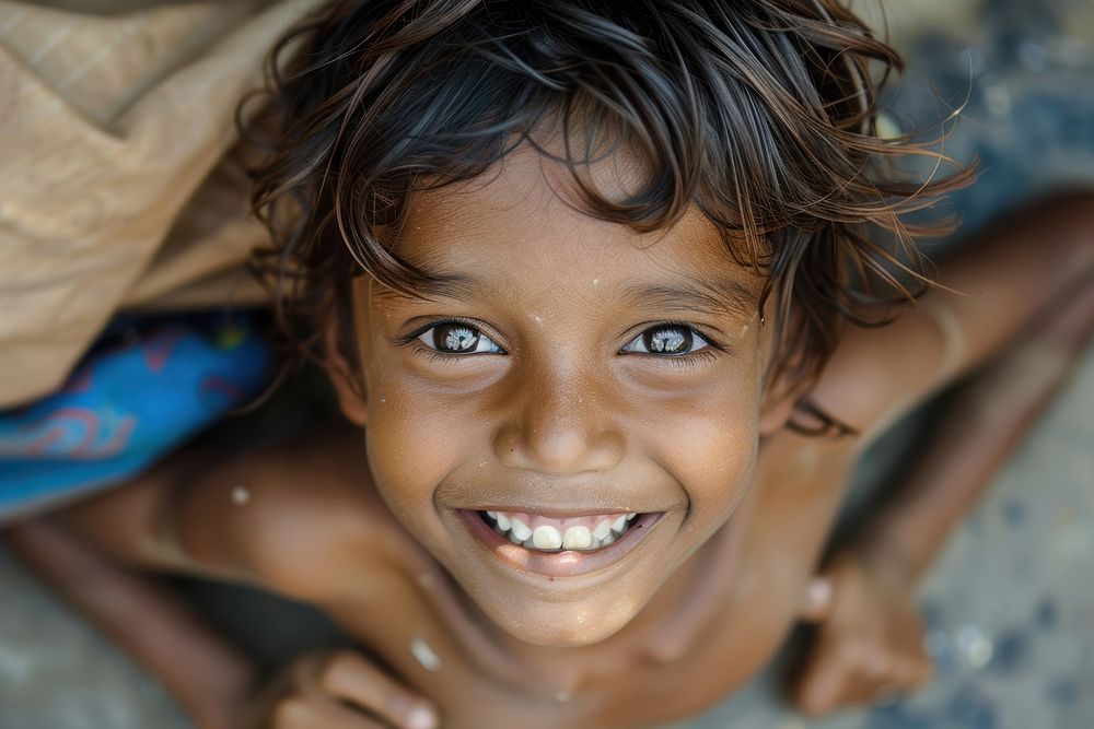 Poor child smiling happily in an atmosphere of poverty person female happy.