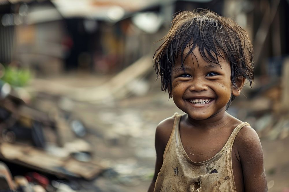 Poor child smiling happily in an atmosphere of poverty shoulder person female.