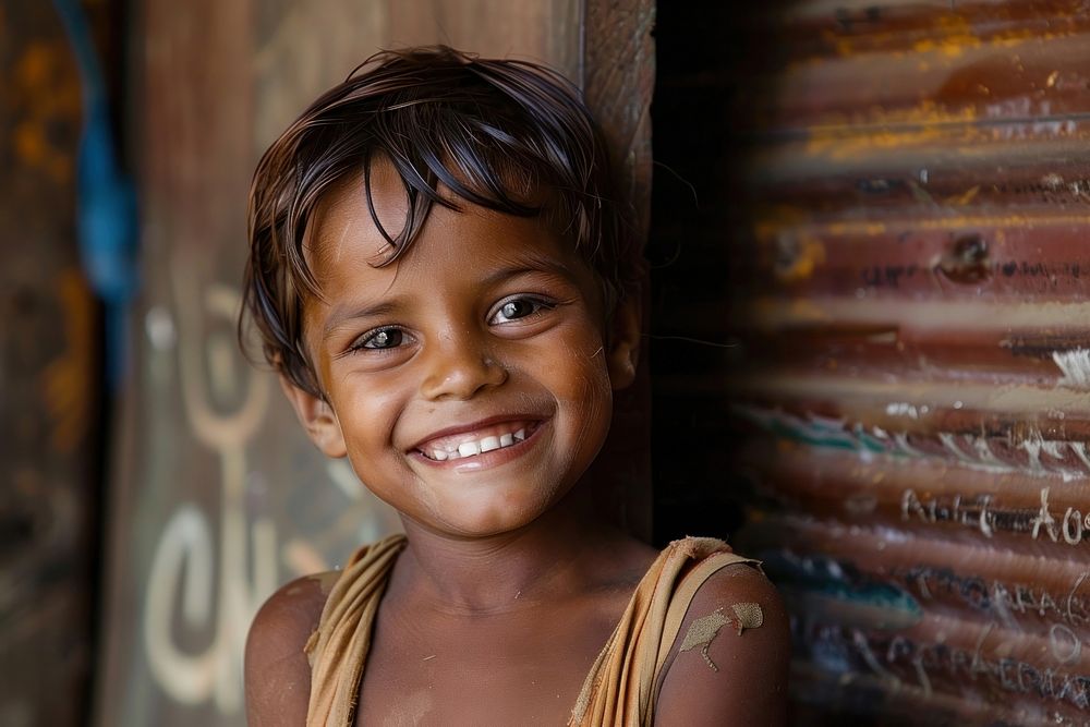 Poor child smiling happily in an atmosphere of poverty accessories accessory shoulder.