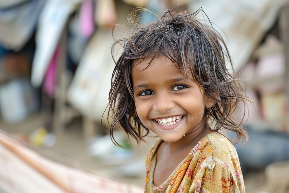 Poor child smiling happily in an atmosphere of poverty shoulder person female.