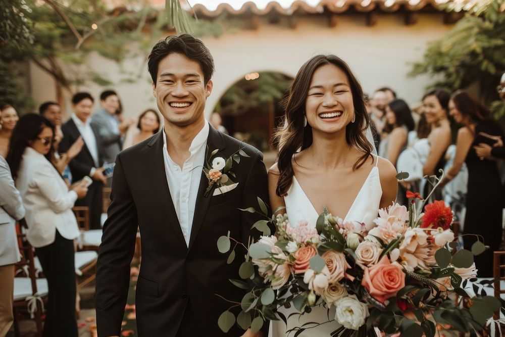 Happy Southeast Asian couple wedding flower suit.