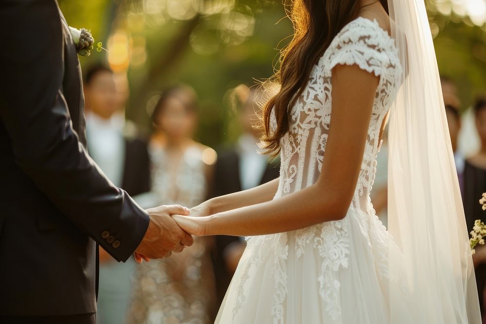 Southeast Asian couple wedding ceremony dress hand holding hands.