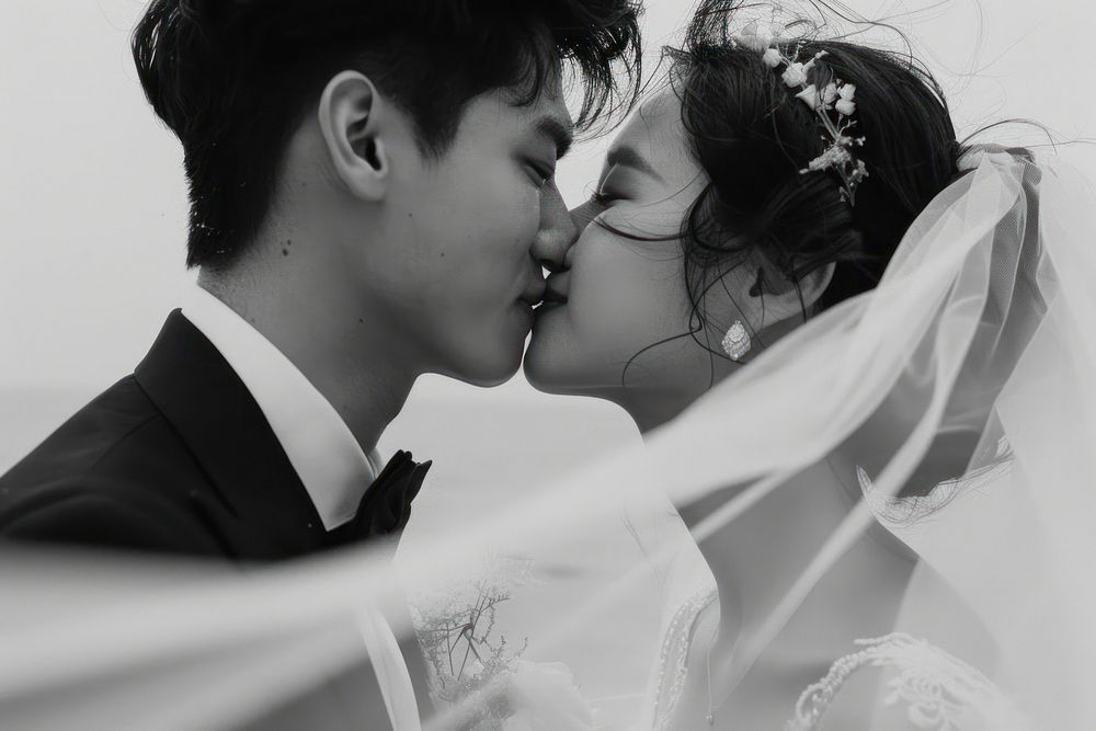 Southeast Asian groom photography kissing wedding.