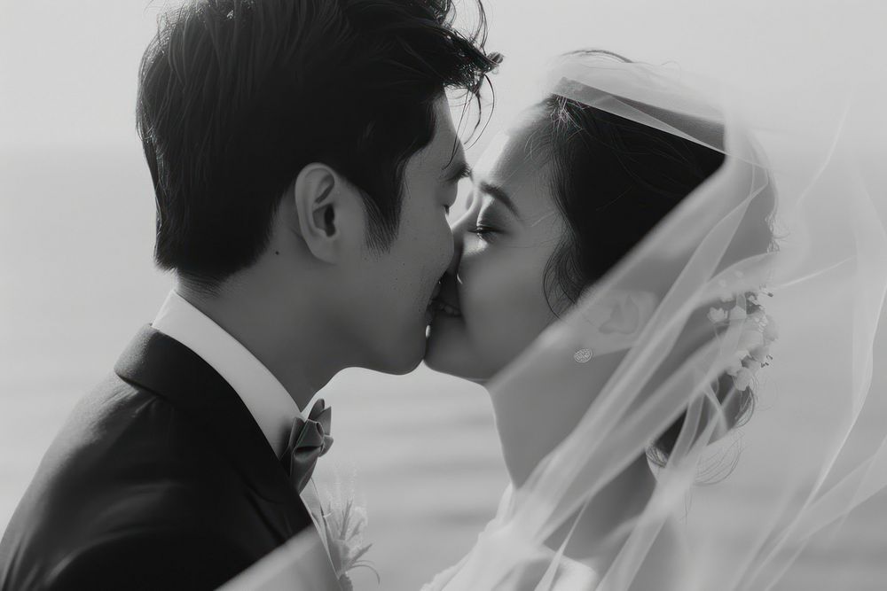 Southeast Asian groom photography kissing wedding.