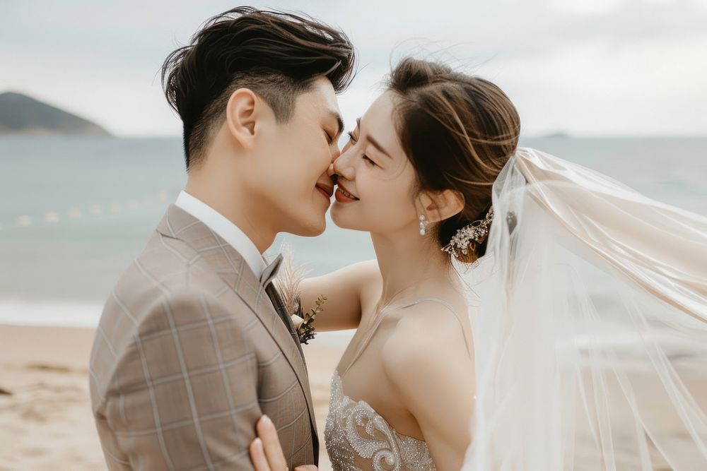Southeast Asian groom photography wedding kissing.