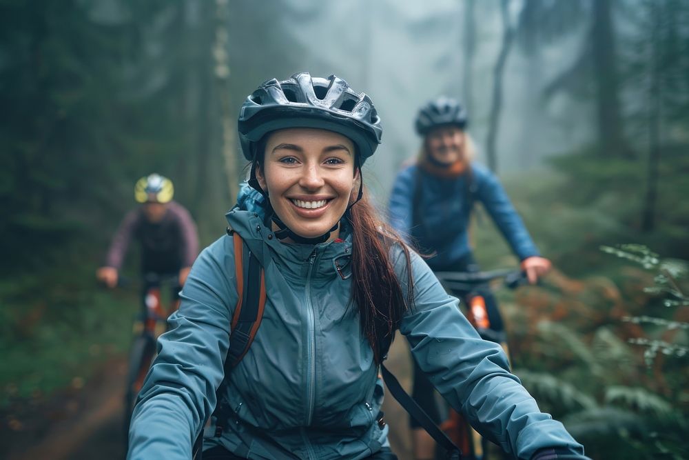 Smiling young woman in cycling gear riding photo bike transportation.