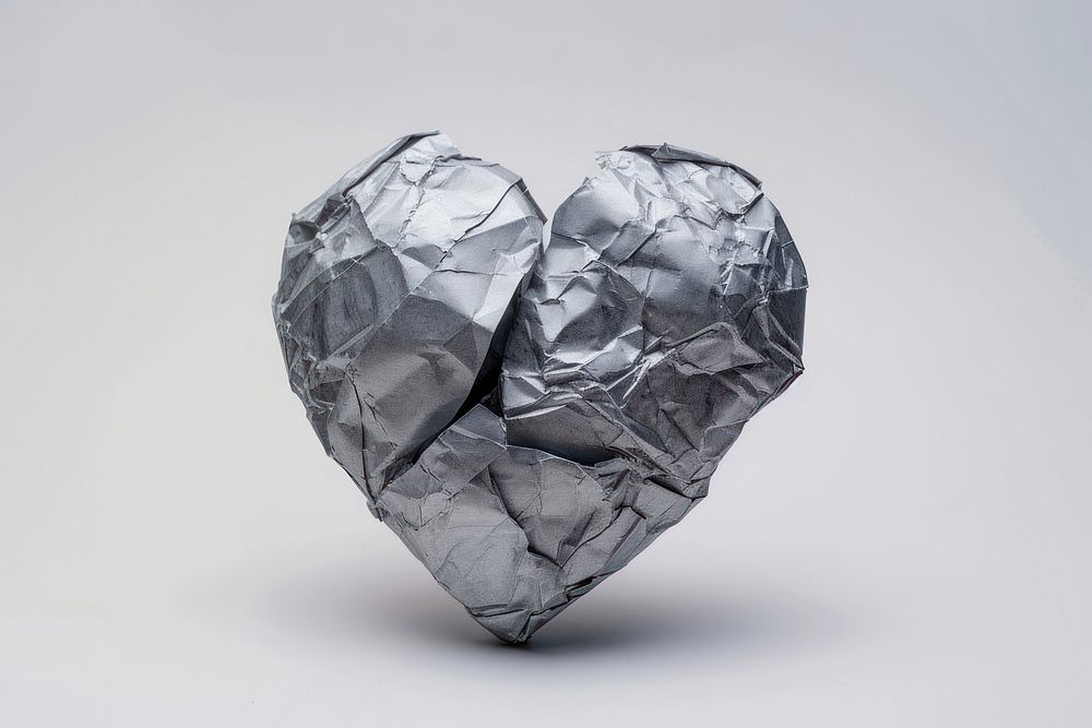 A broken heart in style of crumpled paper accessories accessory.