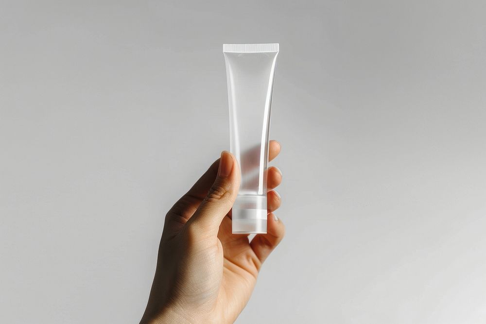 Hand hold transparent cosmetic tube cosmetics bottle.