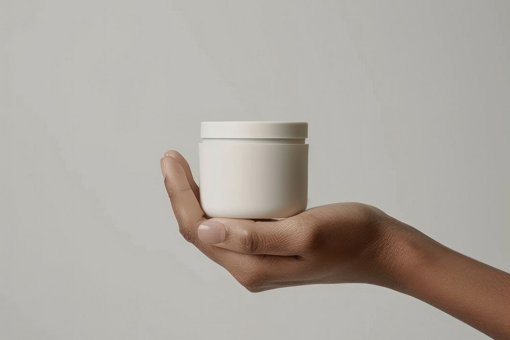 Hand hold white cream jar porcelain beverage pottery.