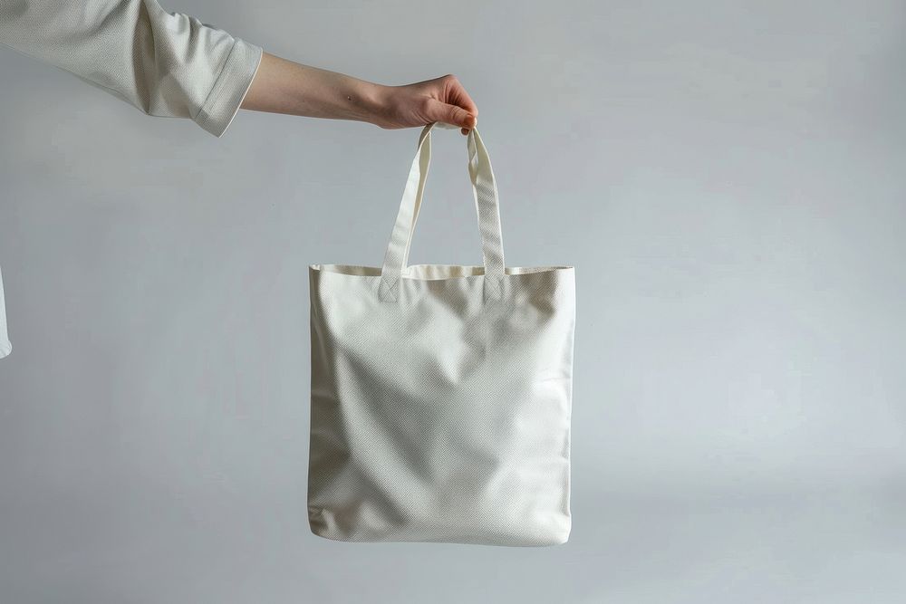 Hand hold white tote bag accessories accessory handbag.