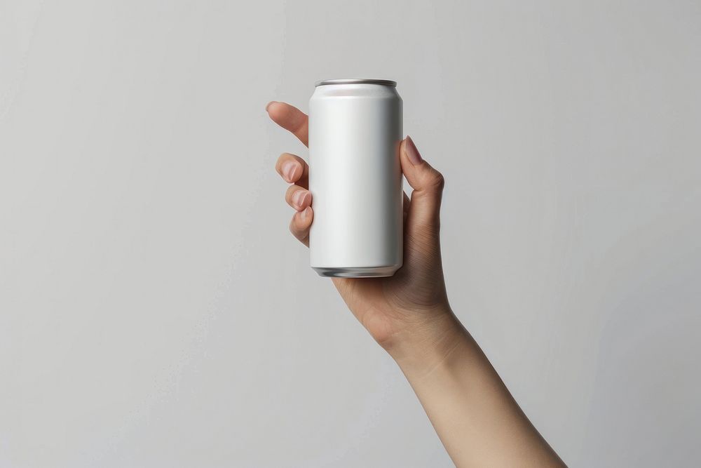 Hand hold white drink can beverage tin.