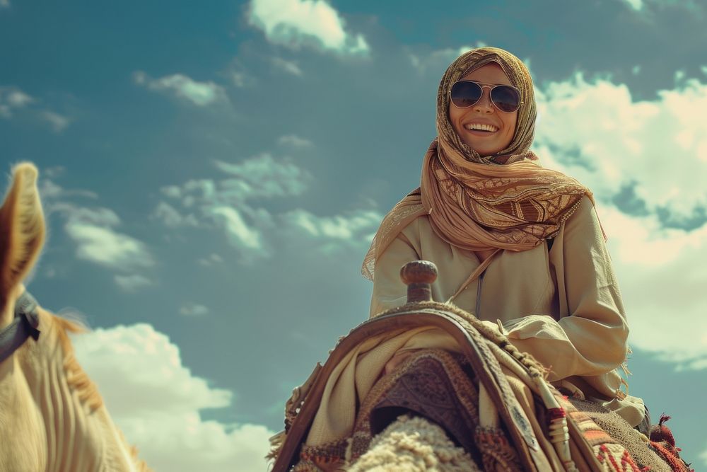 Happy Middle east woman riding camel recreation clothing apparel.