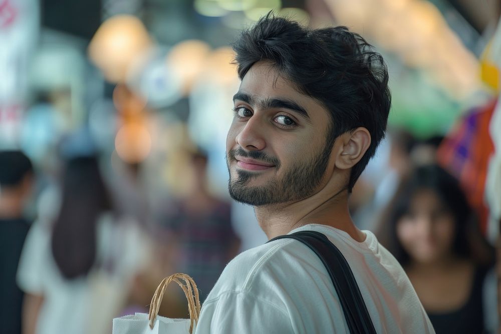 A happy Middle east young men friends with shopping bags face dimples person.