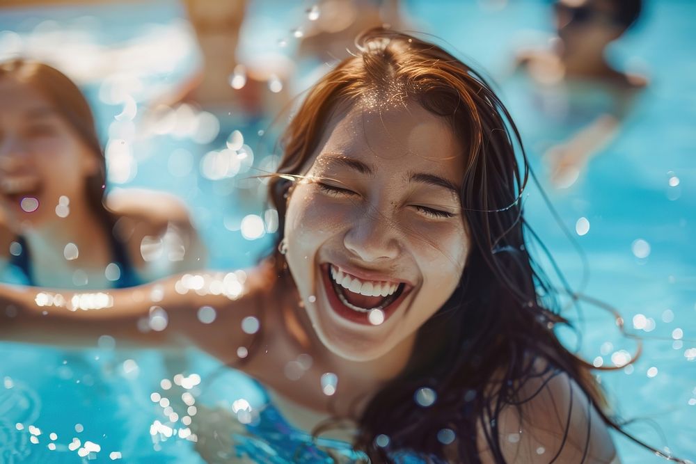 Asian woman laughing and swimming in the pool happy person female.