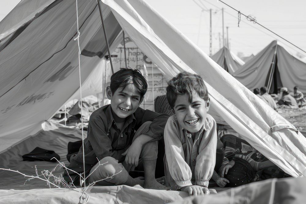 Happy refugees in large tents architecture accessories photography.