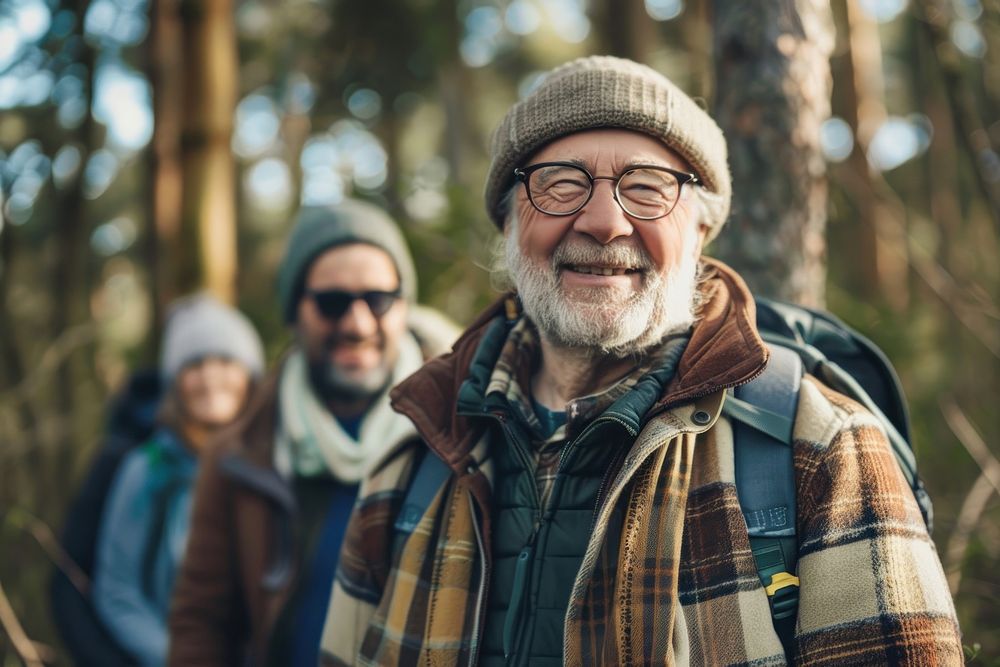 Smiling senior man hiking with friends photo photography accessories.