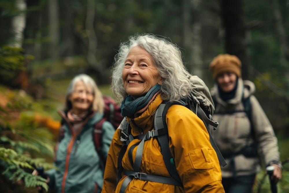 Smiling senior woman hiking with friends transportation recreation adventure.