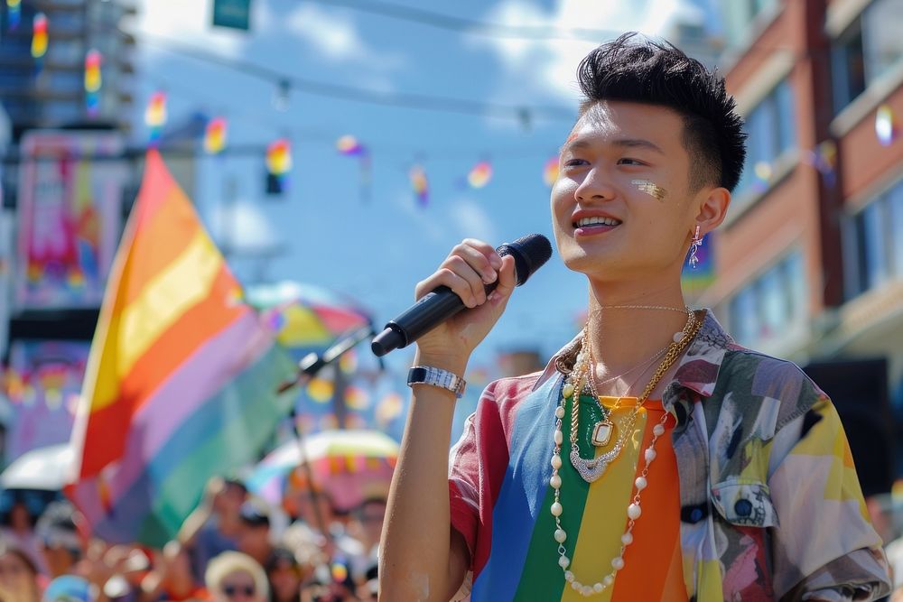 Asian gay with microphone speaking to the crowd audience accessories accessory.