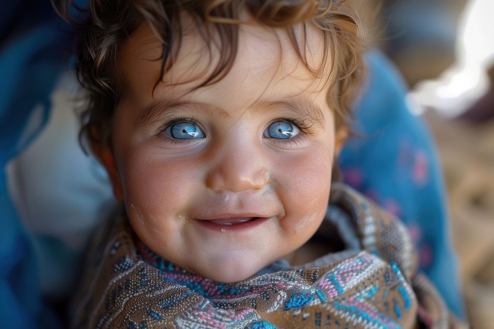 Refugee baby child naive smiling photography portrait person.