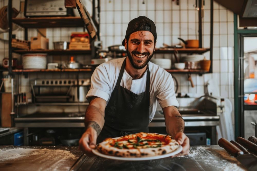 A smiling chef pizza person adult.
