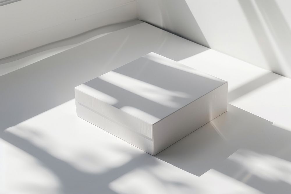 White cardboard box windowsill furniture tabletop.