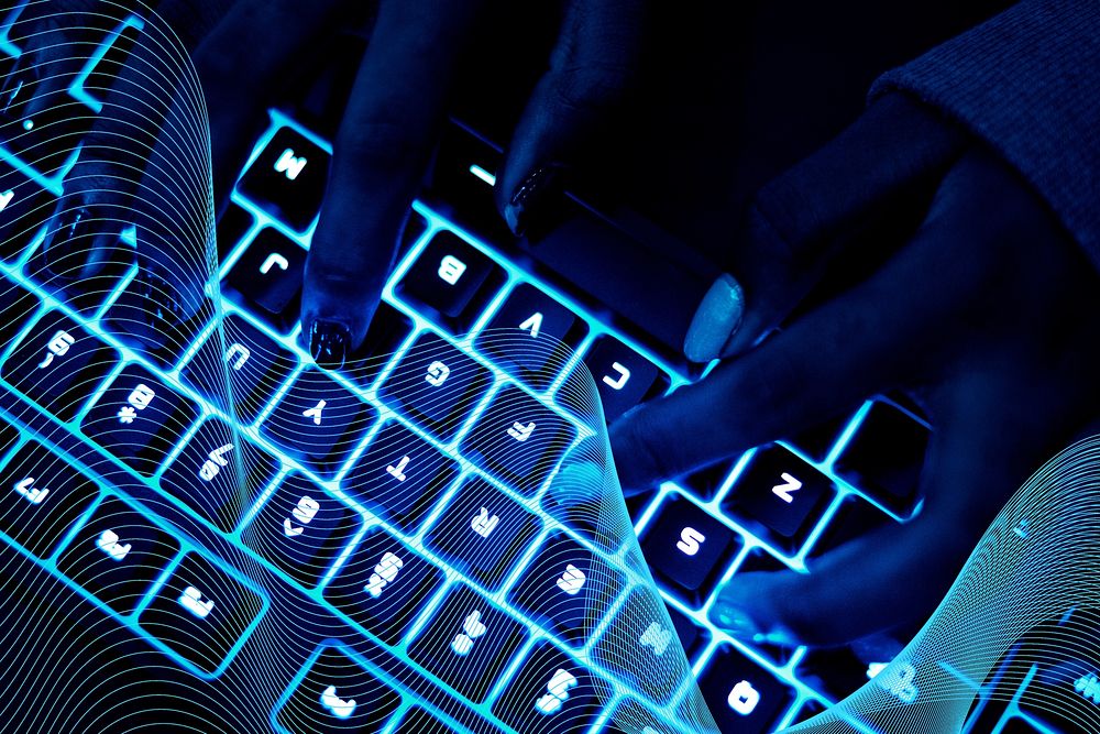 Closeup of hands using a keyboard
