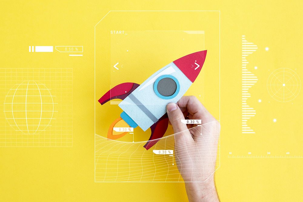 Hand Holding Rocket Spaceship on Yellow Background