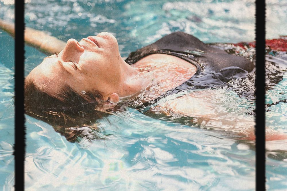 Woman enjoying the water in a swimming pool