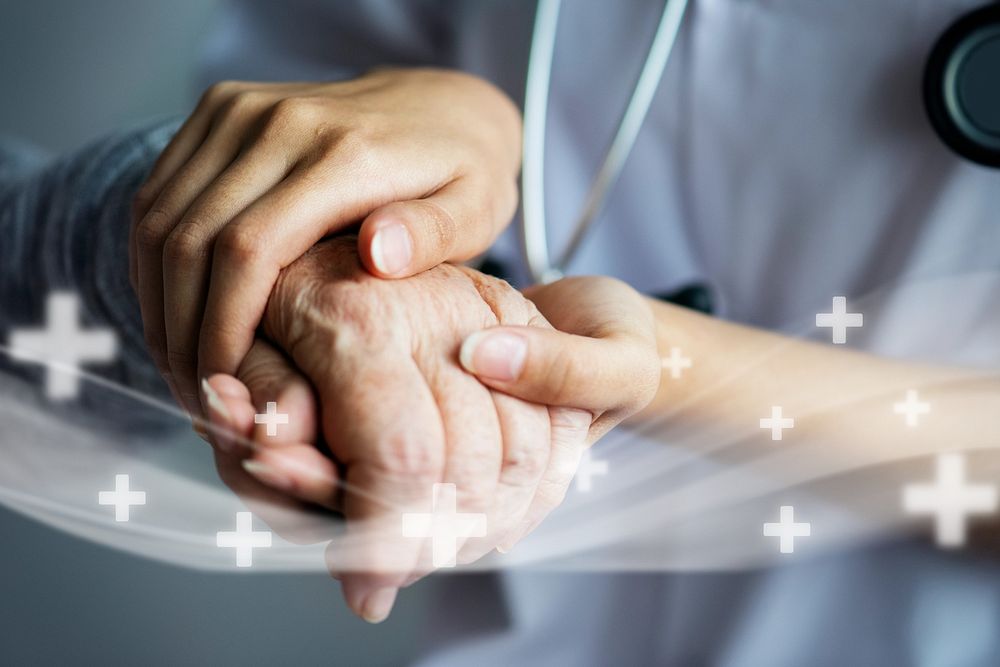 Doctor holding patient's hand, closeup photo remix
